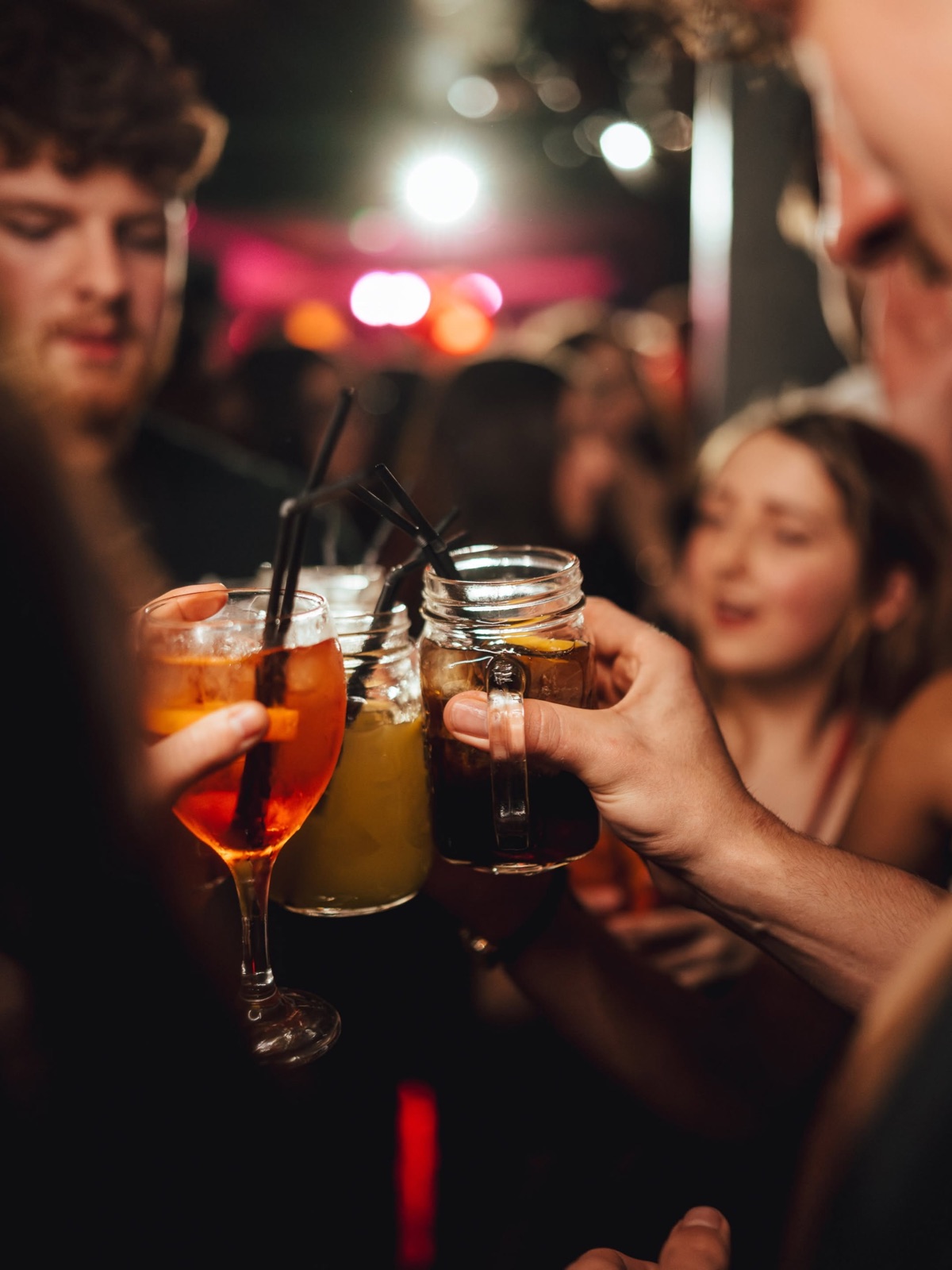 Friends toasting drinks at OMP Mondays, Bristol